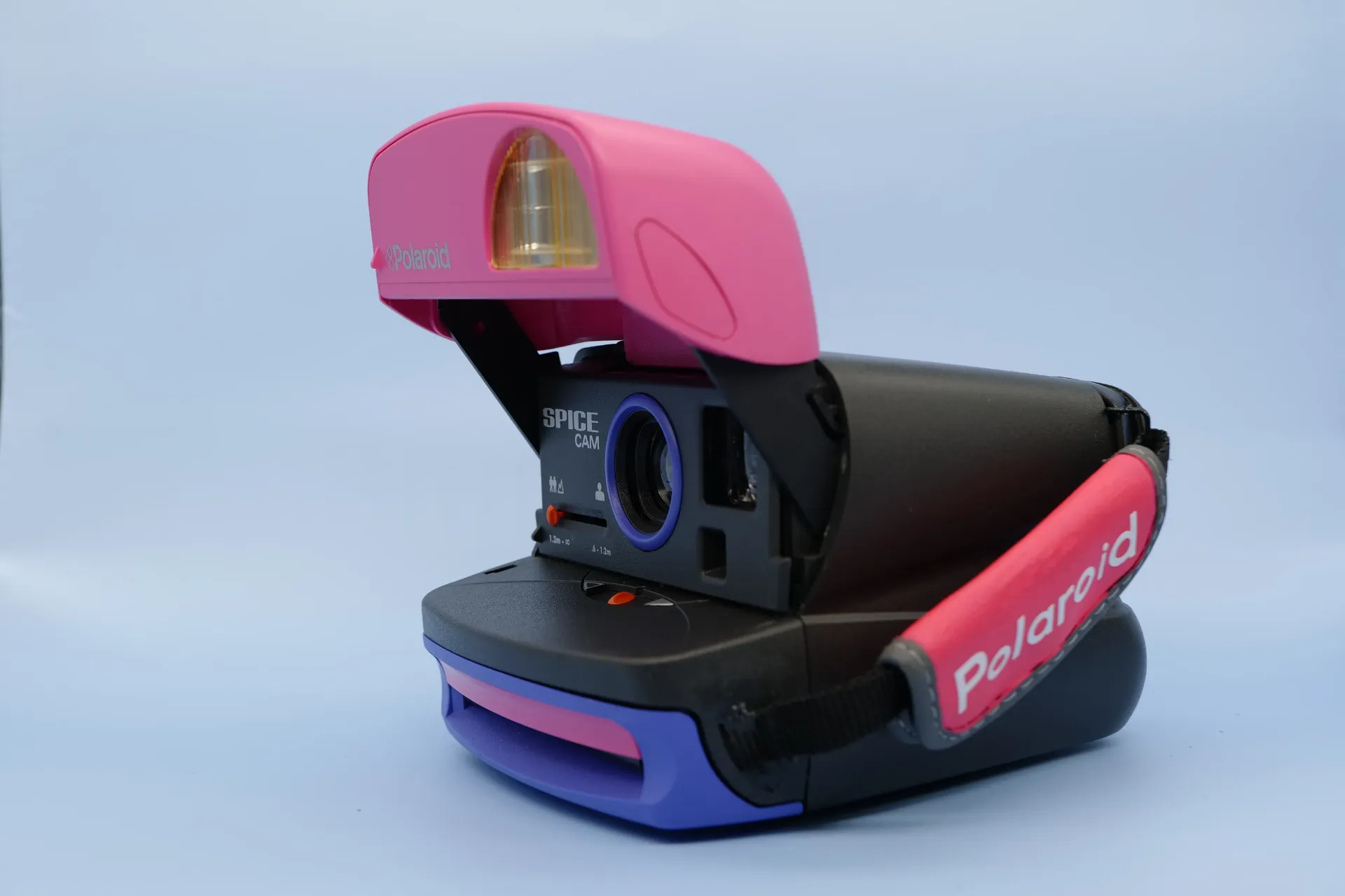 [SDC0604030001] Cámara Polaroid Spice Cam Rosa y Morado